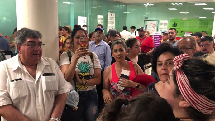 People wait in the Durango Airport after an Aeromexico-operated Embraer passenge