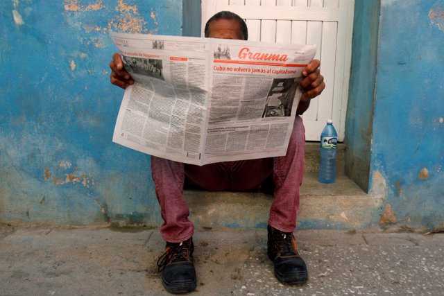 A man reads the daily newspaper Granma in Havana, Cuba, July 21, 2018. The lead 