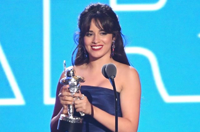 Camila Cabello accepts the award for Artist of the Year on stage at the 2018 MTV