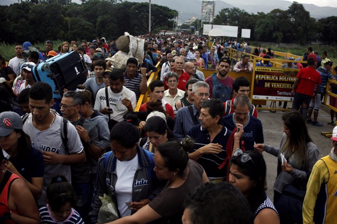 People cross the Colombian-Venezuelan border over the Simon Bolivar internationa