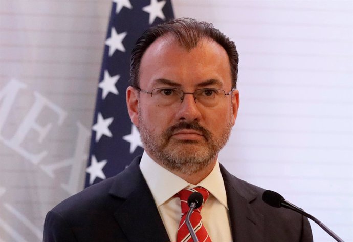 Mexican Foreign Minister Luis Videgaray listens during a news conference beside 