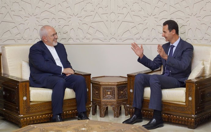 Mohammad Javad Zarif y Bashar al Assad