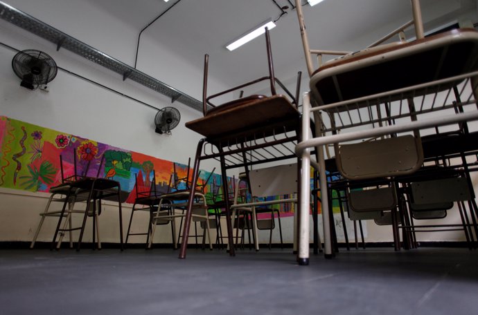 An empty classroom is seen at a public school during a national strike to demand