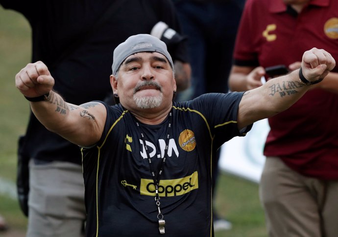 Argentinian soccer legend Diego Armando Maradona reacts to fans during his first