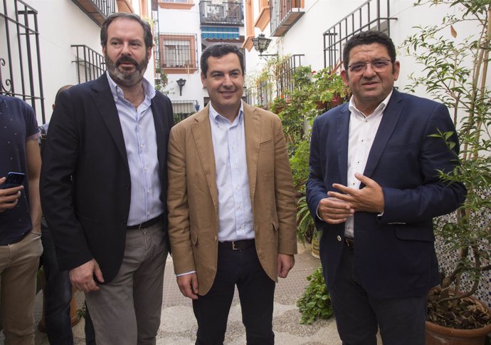 Juanma Moreno con Adolfo Molina y Antonio Manuel Guerra