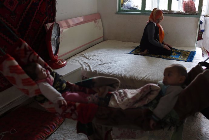 A Uighur family spends their afternoon at their home 