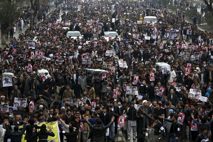 People attend a protest against the killing of seven people from the Hazara comm
