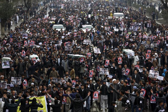 People attend a protest against the killing of seven people from the Hazara comm