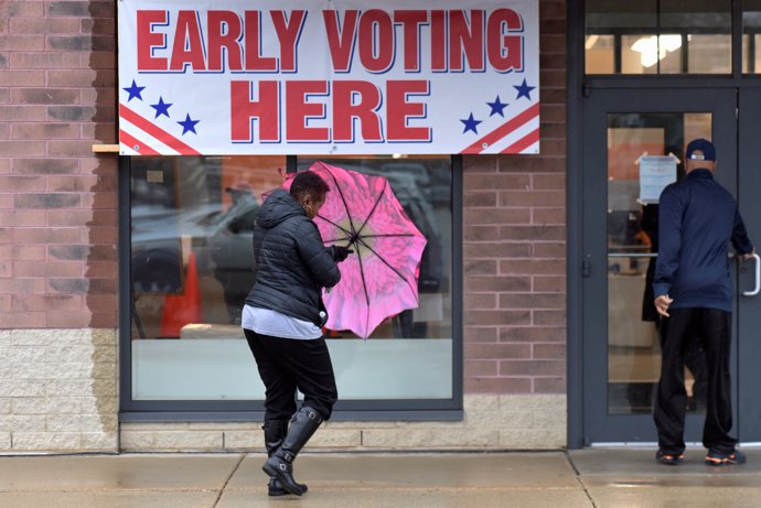 Voters enter an early voting polling station in Milwaukee, Wisconsin, U.S. Novem