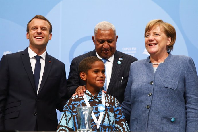 Emmanuel Macron, Frank Bainimarama y Angela Merkel
