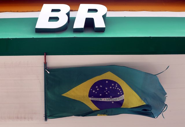 The logo of Brazil's state-run oil company Petrobras is pictured next to a natio