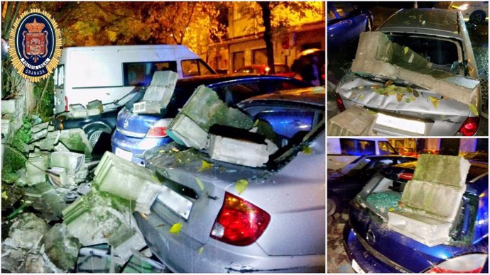 Imágenes de coches destrozados por la caída de un muro en La Chana