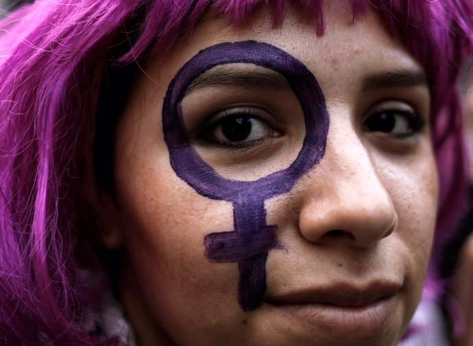 A demonstrator takes part in a march on International Women's Day in Sao Paulo, 
