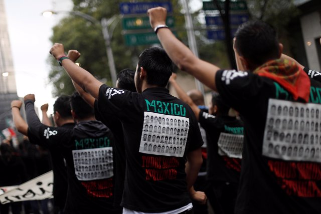 Demonstrators gestures during a march to mark the fourth year since the disappea