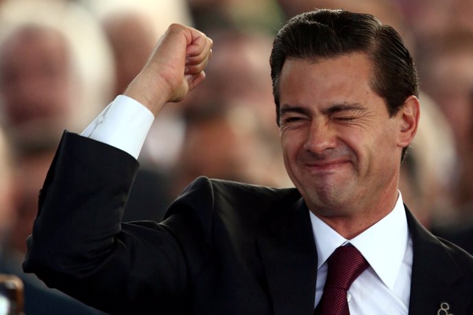 Mexico's President Enrique Pena Nieto gestures during the 80th anniversary of th