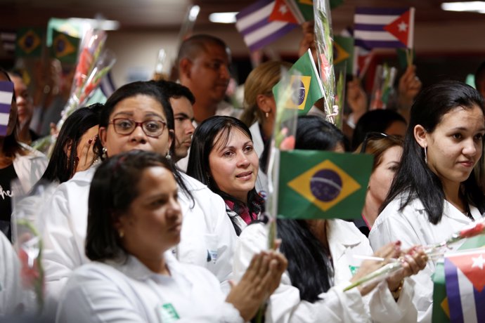 Cuban doctors take part in a welcoming ceremony at the Jose Marti International