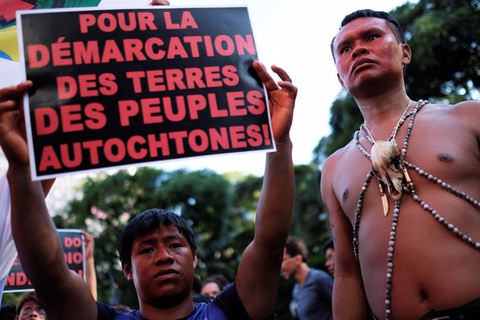 Indigenous men take part in a protest against Brazilian President Jair Bolsonaro