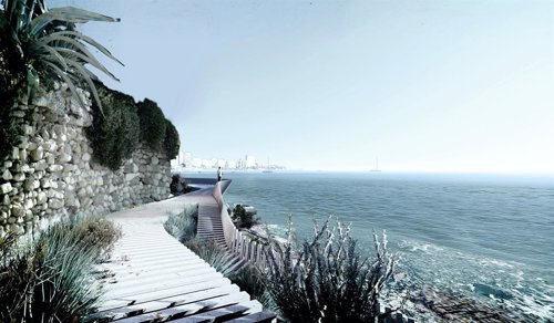 Una de las pasarelas en paralelo a la línea de costa y el Cabo de la Huerta al f