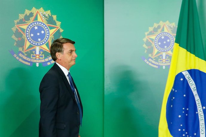 Brazil's President Jair Bolsonaro arrives to gives a statement at the Planalto P