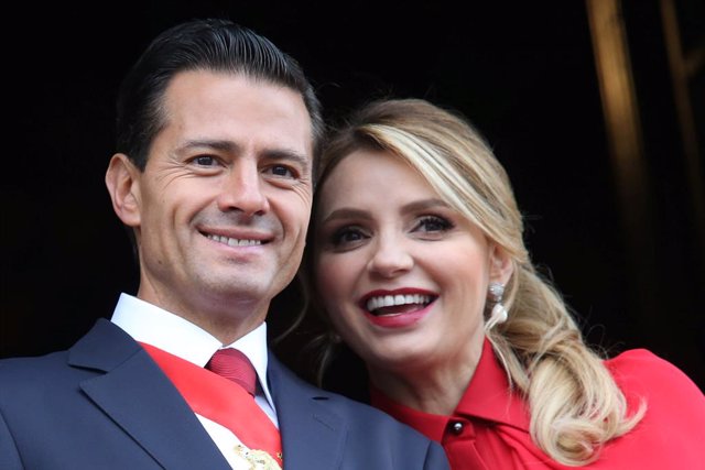 Mexico's President Enrique Pena Nieto smiles with First Lady Angelica Rivera dur