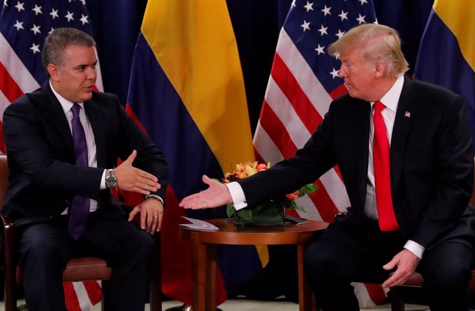 U.S. President Donald Trump is greeted by  Colombia's President Ivan Duque durin