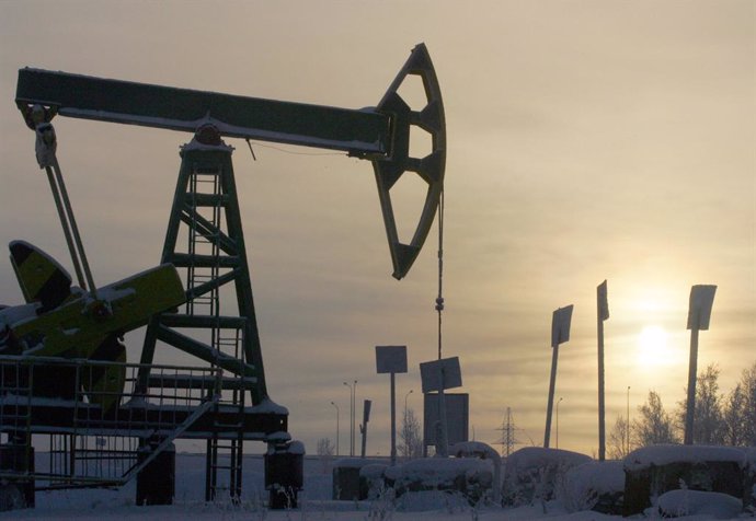 Yukos oil well is seen at sunset near the Russian northern city of Nefteyugansk.