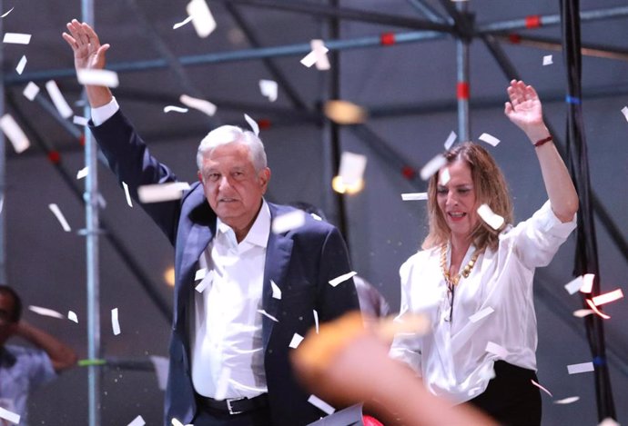 Presidential candidate Andres Manuel Lopez Obrador gestures with his wife Beatri