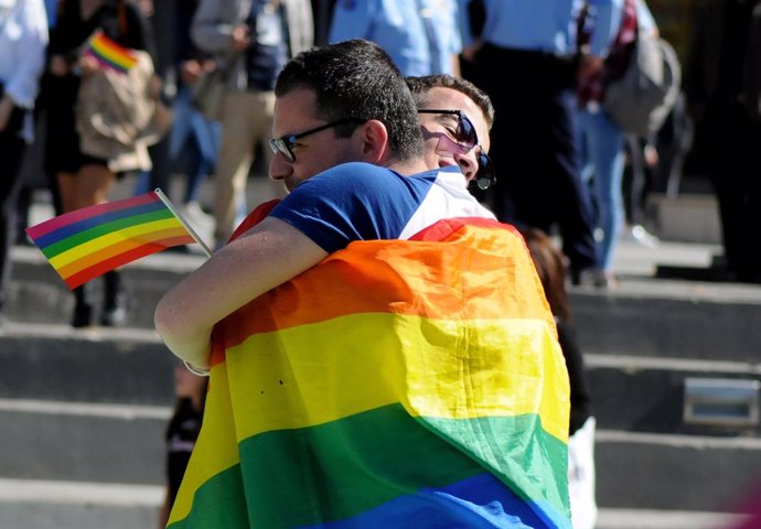 People hug during the second lesbian, gay, bisexual and transgender (LGBT) Pride