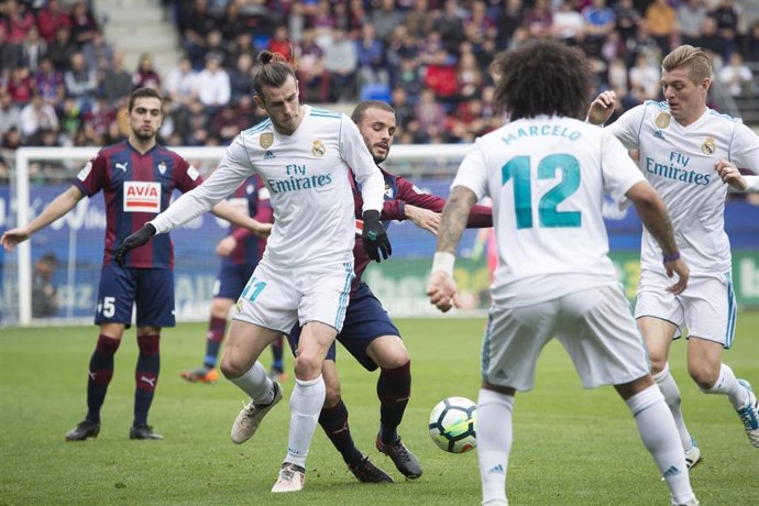 Pedro Leon of Eibar and Bale of Real Madrid in action during the Santander Leagu