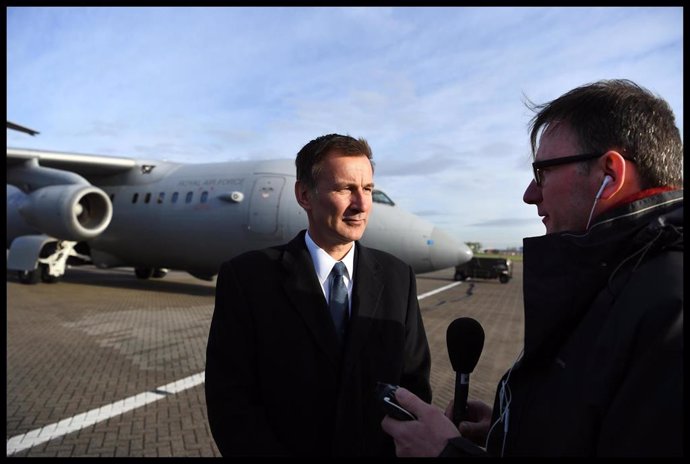 Jeremy Hunt Working on the Plane