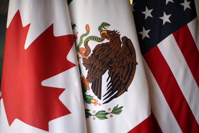 FILE PHOTO: Flags are pictured during NAFTA talks involving the United States, M