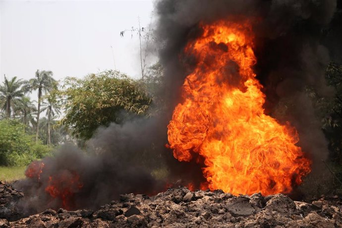 Fire burns on the Shell Petroleum Development Company Trans Niger pipeline at Mogho