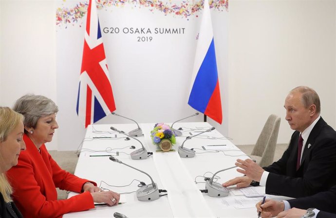 Primera ministra británica, Theresa May, y el presidente de Rusia, Vladimir Putin