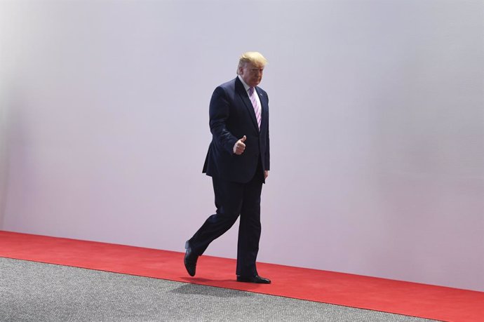 28 June 2019, Japan, Osaka: US President Donald Trump leaves after the welcoming ceremony of the G20 summit. Photo: Lukas Coch/AAP/dpa