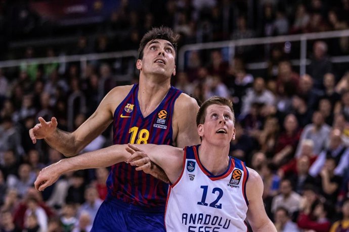 Pierre Oriola, #18 of FC Barcelona Lassa and Brock Motum, #12 of Anadolu Efes Istanbul during EuroLeague Basketball match between FC Barcelona Lassa and Anadolu Efes Istanbul  on December 27, 2018 at Palau Blaugrana, in Barcelona, Spain.