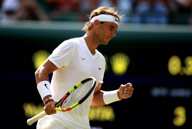 02 July 2019, England, London: Spanish tennis player Rafael Nadal in action against Japan's Yuichi Sugita during their men's singles round of 128 match on day two of the 2019 Wimbledon Grand Slam tennis tournament at the All England Lawn Tennis and Croque