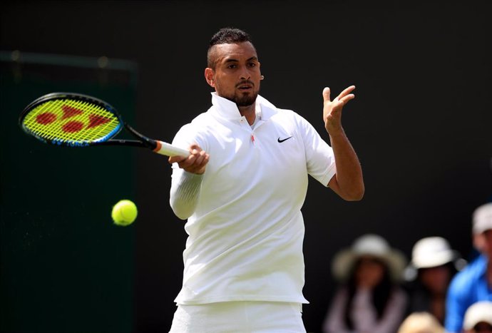 02 July 2019, England, London: Australian tennis player Nick Kyrgios in action against compatriot Jordan Thompson during their men's singles round of 128 match on day two of the 2019 Wimbledon Grand Slam tennis tournament at the All England Lawn Tennis 