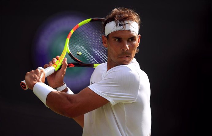 02 July 2019, England, London: Spanish tennis player Rafael Nadal in action against Japan's Yuichi Sugita during their men's singles round of 128 match on day two of the 2019 Wimbledon Grand Slam tennis tournament at the All England Lawn Tennis and Croq