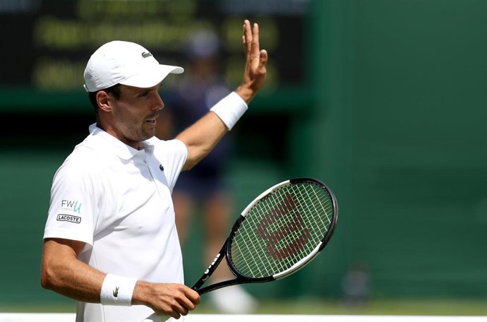 01 July 2019, England, London: Spanish tennis player Roberto Bautista Agut celebrates victory after defeating Germany's Peter Gojowczyk in their men's singles round of 128 match on day one of the 2019 Wimbledon Grand Slam tennis tournament at the All En