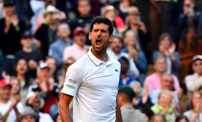 03 July 2019, England, London: Serbian tennis player Novak Djokovic celebrates victory after defeating US Denis Kudla in their men's singles round of 64 match on day three of the 2019 Wimbledon Grand Slam tennis tournament at the All England Lawn Tennis