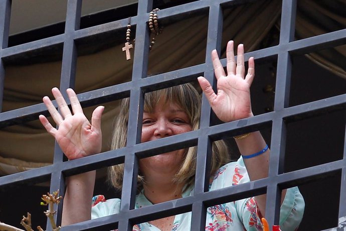 FILE PHOTO: Judge Afiuni waves from the window of her house in Caracas