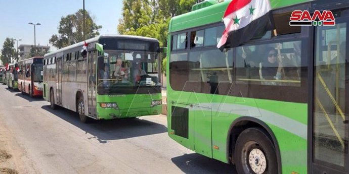 Civiles desplazados volviendo a Qussair, en la provincia siria de Homs