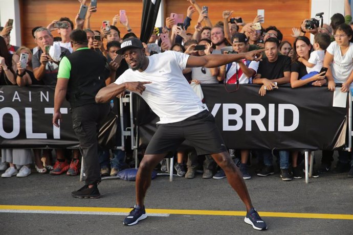 02 April 2019, Peru, Lima: Jamaican retired sprinter Usain Bolt celebrates after winning a race against a motorcycle taxi during an event as part of a tour in Peru. Photo: El Comercio/GDA via ZUMA Wire/dpa