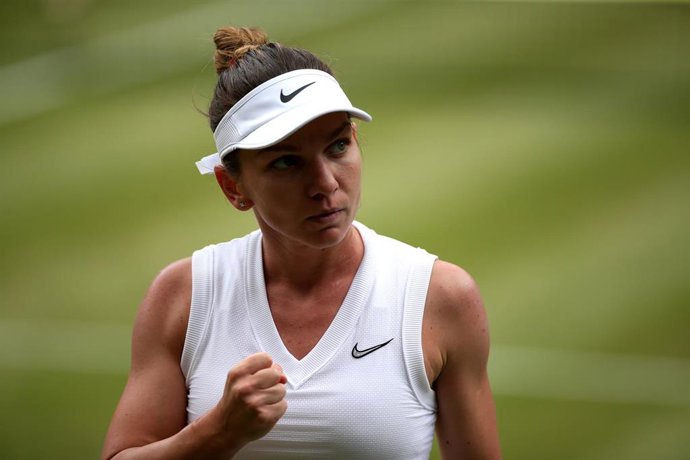 13 July 2019, England, London: Romanian tennis player Simona Halep celebrates during her women's singles final match against US Serena Williams on day twelve of the 2019 Wimbledon Grand Slam tennis tournament at the All England Lawn Tennis and Croquet C