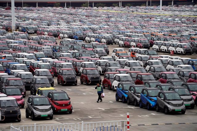 FILE PHOTO: Baojun E100 and E200 all-electric battery cars sit parked at a parking lot operated by General Motors Co and its local joint-venture partners in Liuzho