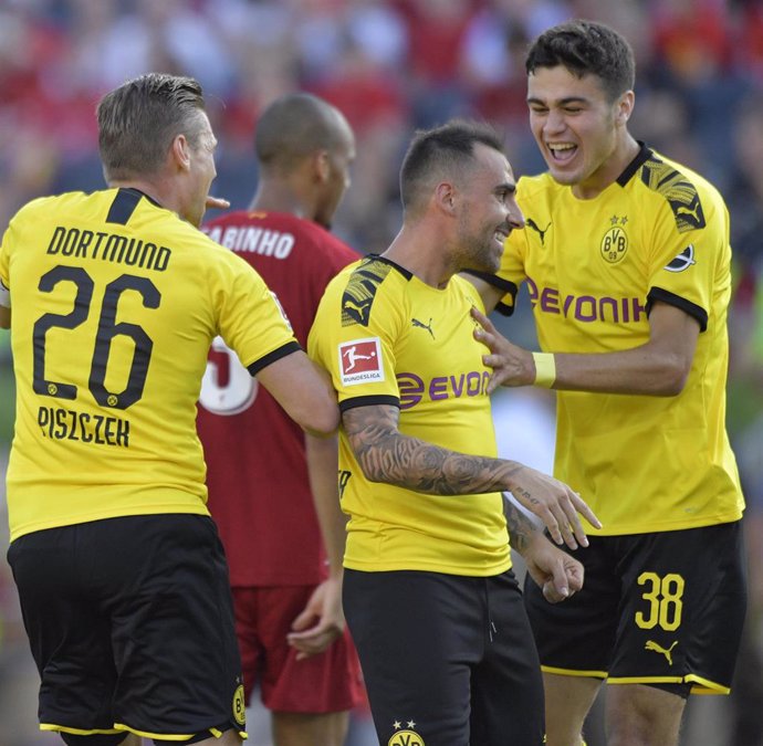 19 July 2019, US, South Bend: Borussia Dortmund Lukasz Piszczek (L), Giovanni Reyna (R) and Paco Alcacer celebrate scoring during the friendly pre-season soccer match between Liverpool FC and Borussia Dortmund at Notre Dame Stadium. Photo: Tim Vizer/dpa