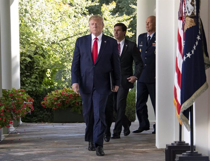 August 29, 2019 - Washington, DC, United States: United States President Donald J. Trump, followed by US Secretary of Defense Dr. Mark T. Esper and General John W. "Jay" Raymond, Commander, Air Force Space Command, walk on the colonnade to announce the 