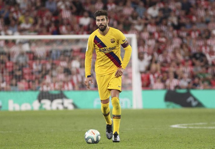 Piqué en San Mamés con el Bara