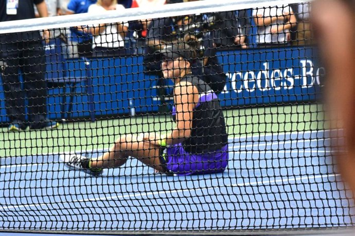 September 7, 2017 Queens, New York, United States: Bianca Andreescu (CAN) sits on the court after winning the Woman's Title victory in the US Open opposite Serena Williams. at the Billie Jean King National Tennis Center. The score was 6-3, 7-5. (Rick Ma