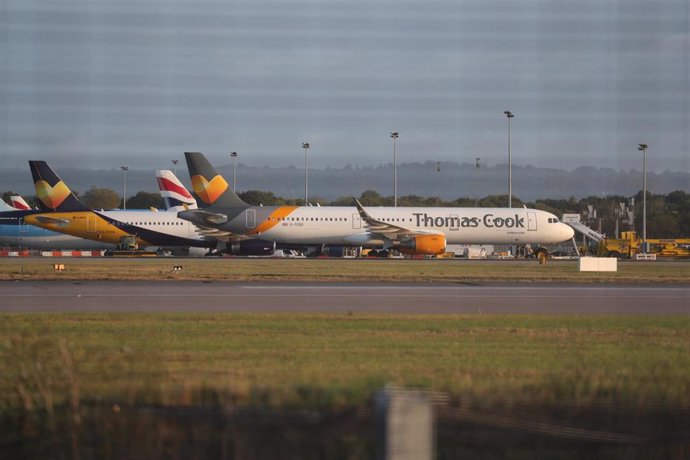 23 September 2019, England, Gatwick: An Airbus A321 from the airline Condor with the design of the tourism company Thomas Cook stands on the tarmac at Gatwick Airport. Thomas Cook, one of Britain's biggest travel firms, filed for liquidation early Monda